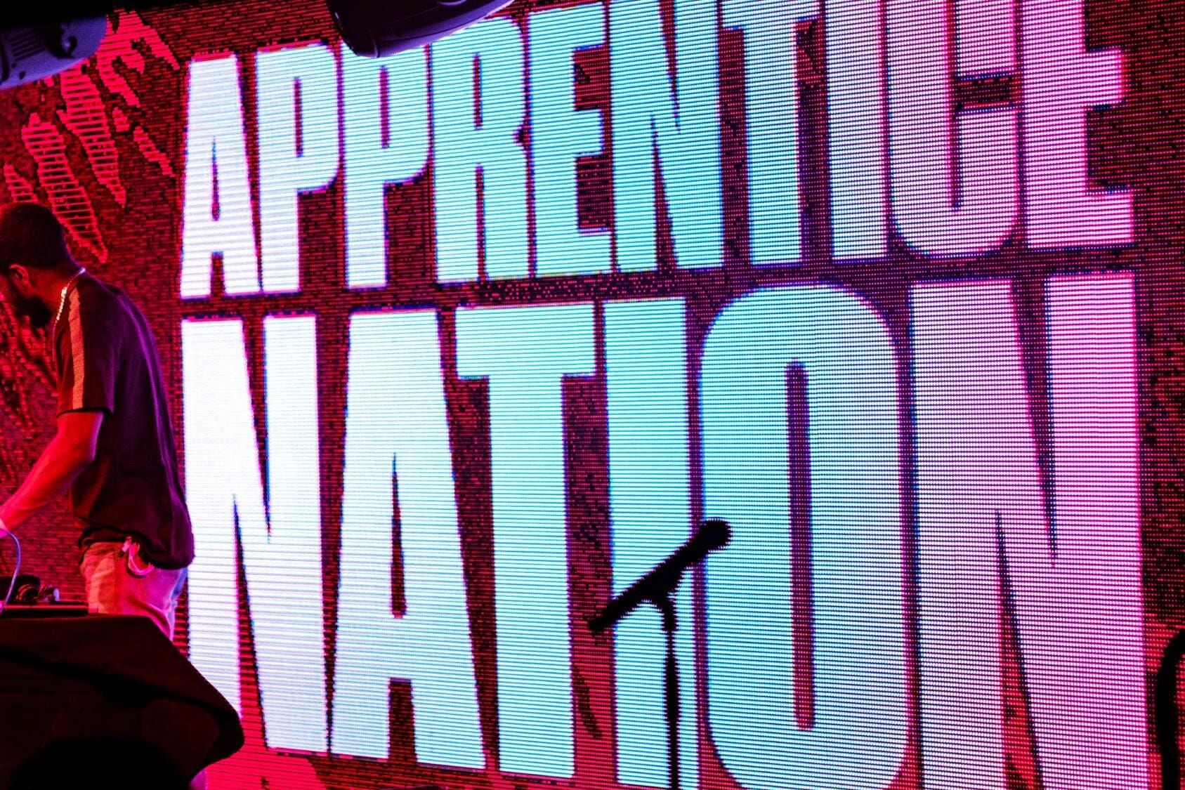 The Apprentice Nation logo lit up on stage